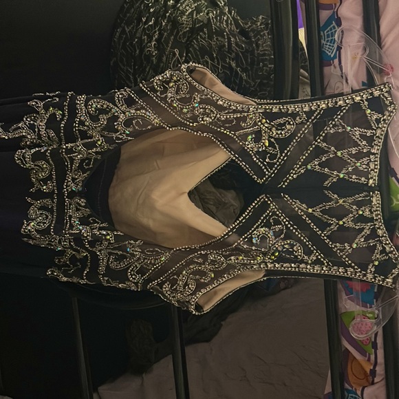 It is a 2XL in Chinese sizing. It is Dark charcoal grey, open back, with a shaw - Picture 2 of 2